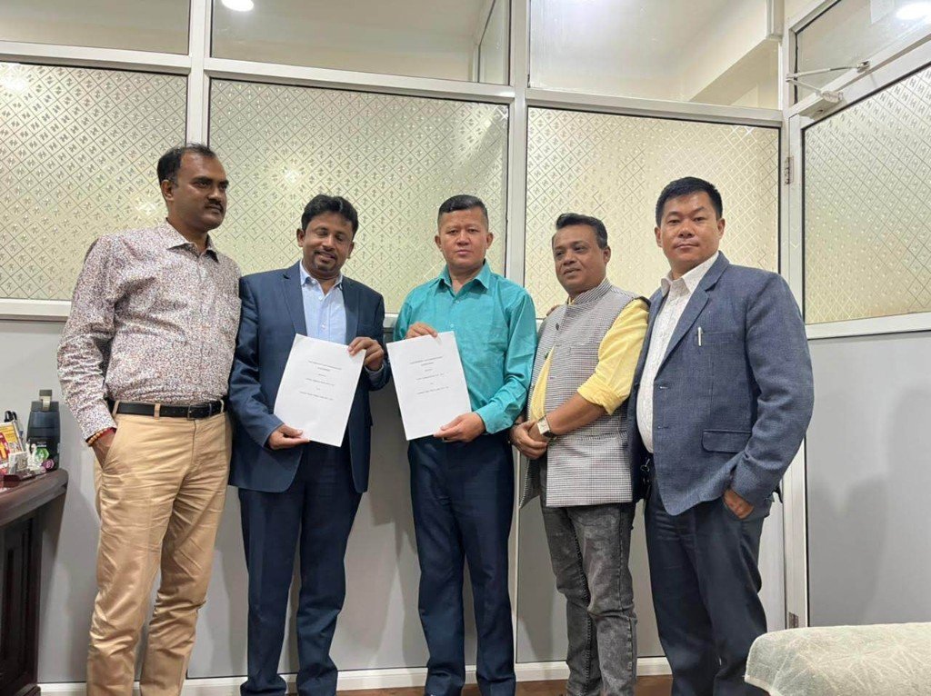 CFIPEC and partner representatives presenting signed copies of the agreement.